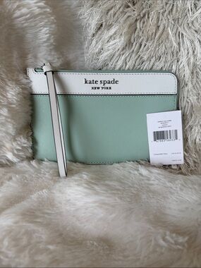 kate spade mint green and white wristlet clutch